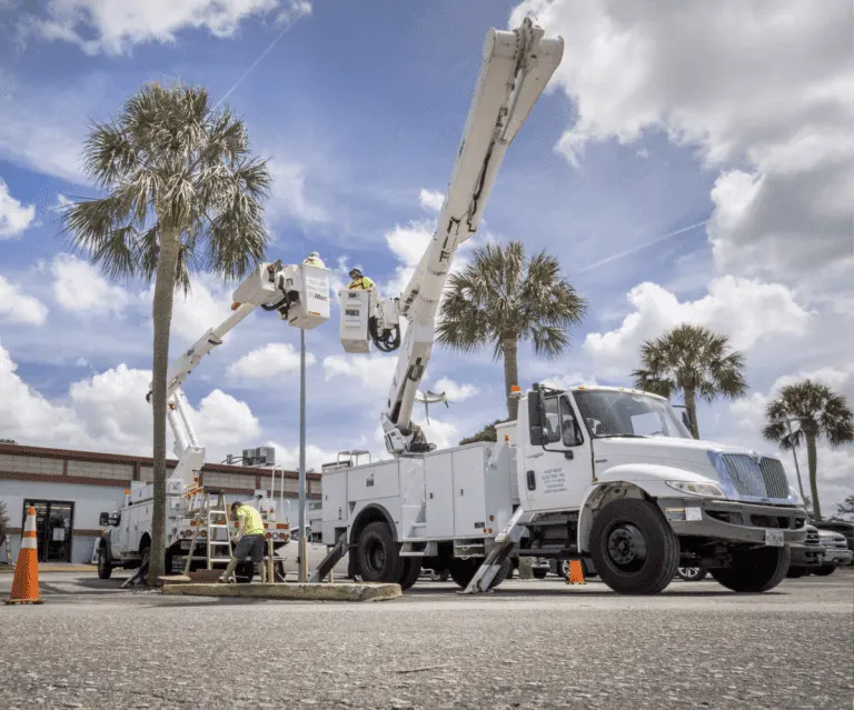 Commercial electrician working from a bucket truck