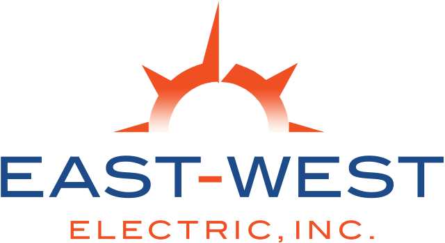 Logo of East-West Electric, Inc. featuring a stylized sun with orange rays peeking over a horizon. The sun is positioned above the blue text "EAST-WEST" and the orange text "ELECTRIC, INC." below it, symbolizing the trusted electricians in Clearwater.
