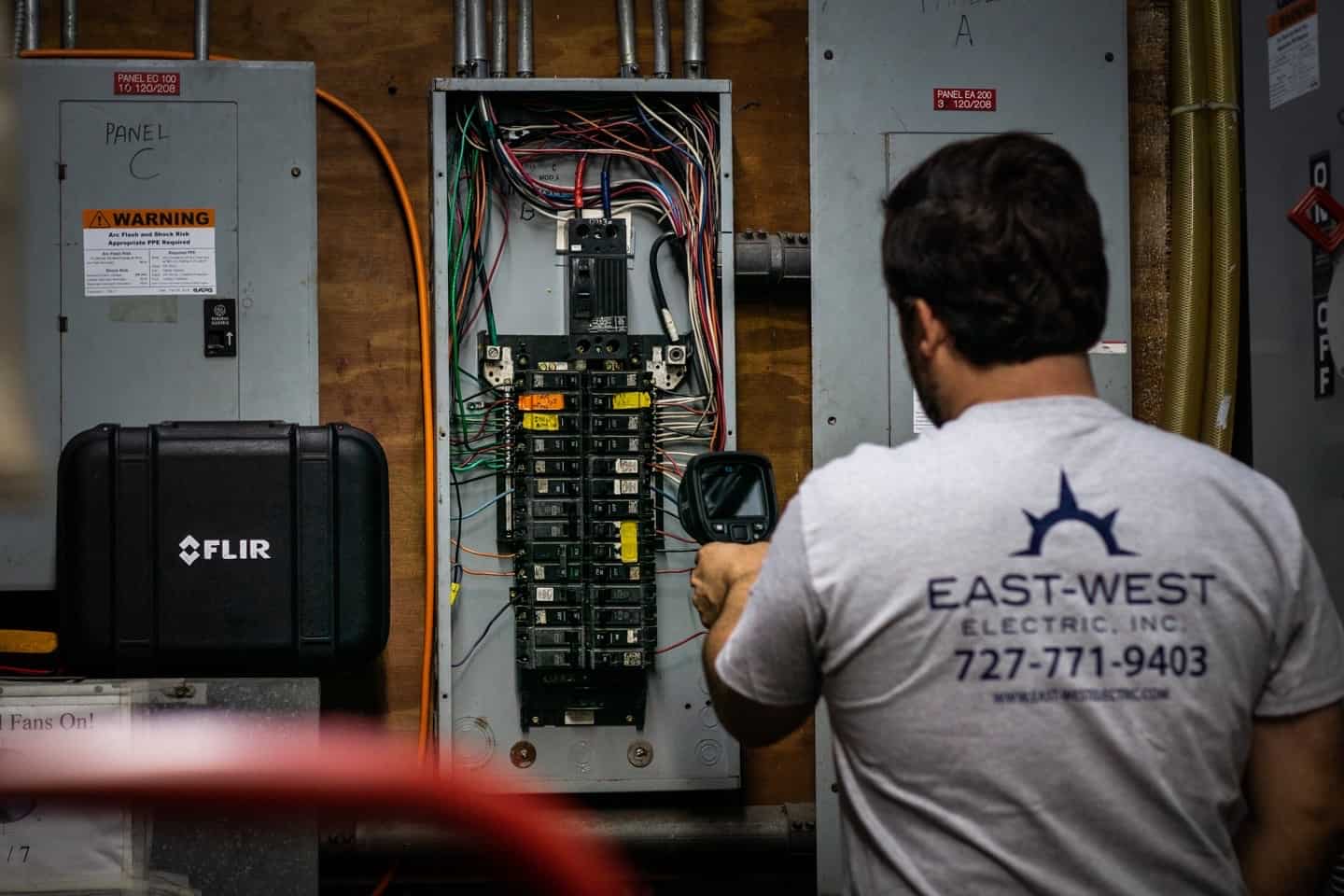 East-West electrician performing corrective electrical work